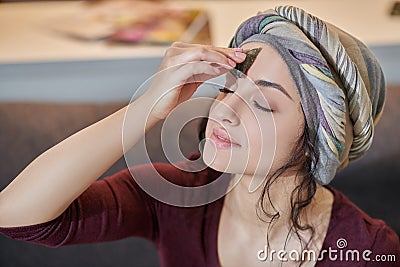 Magician using a crystal for opening her third eye chakra Stock Photo