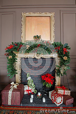 Calm image of interior Classic New Year Tree decorated in a room with fireplace Stock Photo
