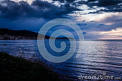 Calm Ocean Before The Storm With Rain Clouds Stock Photo