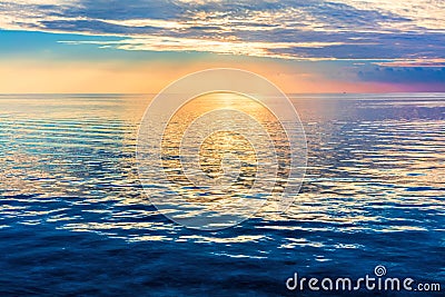 Calm ocean at sunset. Dramatic sky Stock Photo