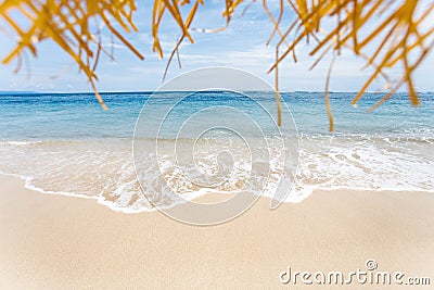 Calm and relaxing empty beach scene, blue sky and white sand. Stock Photo