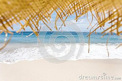 Calm and relaxing empty beach scene, blue sky and white sand. Stock Photo