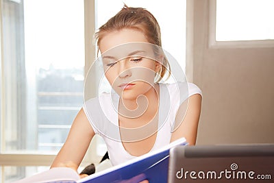 Calm and serious teenage girl with big notepad Stock Photo