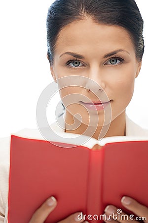 Calm and serious woman with book Stock Photo