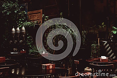 Calm shady interior of an outdoor cafe terrace Stock Photo