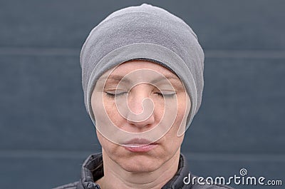 Calm unemotional woman with closed eyes Stock Photo