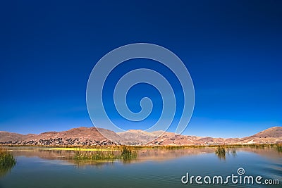 Calm waters on the shore of Titicaca Lake Stock Photo