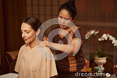 Serene patient being treated for neck pain Stock Photo
