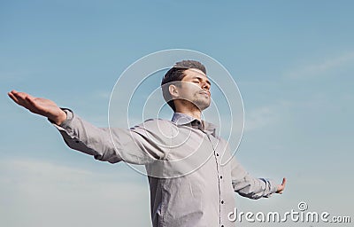 Calm young man portrait over blue sky Stock Photo