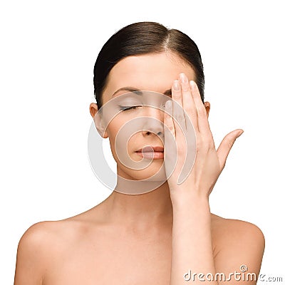 Calm young woman covering face with hand Stock Photo