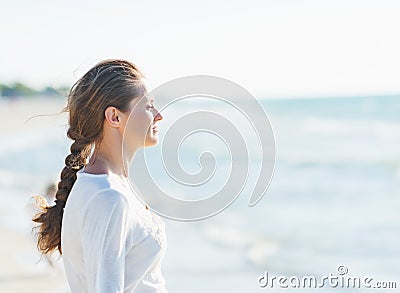 Calm young woman looking into distance at seaside Stock Photo