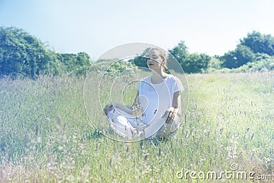 Calm young yoga woman with eyes closed for centered mindfulness Stock Photo