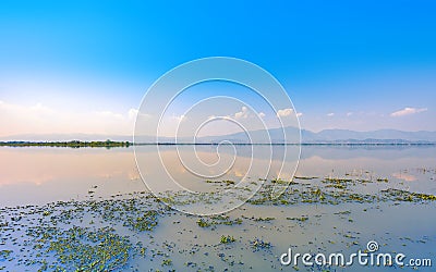 Calmness lake in the morning with mountain Stock Photo