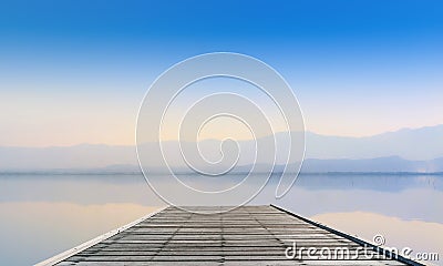 Calmness Lake with mountain in sunset Stock Photo