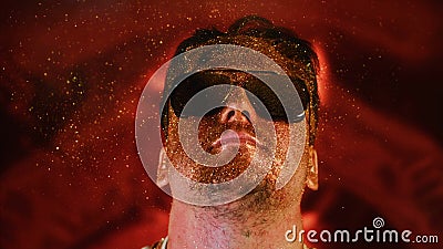 Calmness relax chill face man in gold glitter. Comical photo funny person. Blowing powder, individual refresh. Serenity Stock Photo