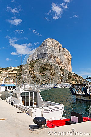 Calp Spain marina with boats and famous rock landmark Stock Photo