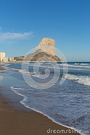 Calp Spain Penon de Ilfach landmark rock blue sky and waves Stock Photo
