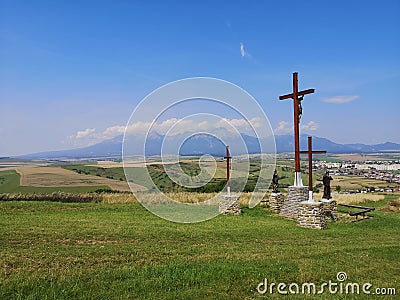 Calvary crosses and staues with High Tatras in background Stock Photo