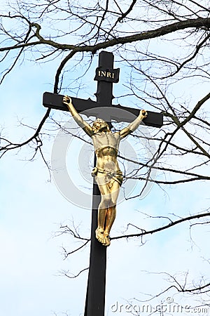 Calvary with golden Jesus Stock Photo