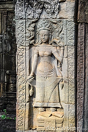 Cambodia. Angkor. Banteay Kdei Temple. Sculpture on bas relief of Devata Editorial Stock Photo