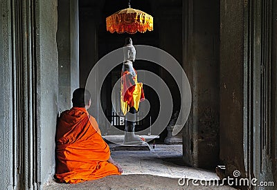 Cambodia Angkor Wat time to pray Stock Photo