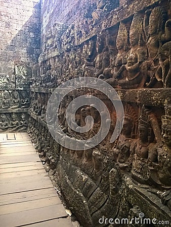 Cambodia Architecture. Bas-relief. A rough-carved figure on the frontage of the Terrace of the Leper King. Wall Carving Stock Photo