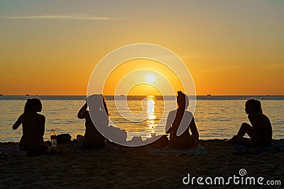 Cambodia. Koh Rong Samloem Island, young girls sitting on a beach Editorial Stock Photo