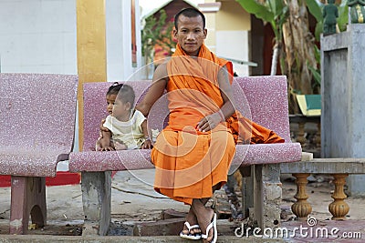 Cambodia Monk with Baby Editorial Stock Photo