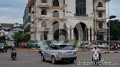 Busy intersection, traffic on a city street, cloudy weather Editorial Stock Photo