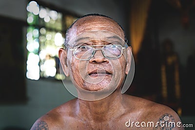 Cambodian buddhist monk with glasses at temple Wat Krabi Riel Pagoda, Siem Reap Province, Cambodia Editorial Stock Photo