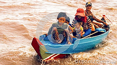 Cambodian family on a boat on Tonle Sap Lake. Editorial Stock Photo