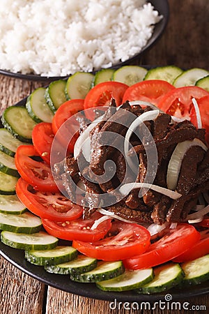 Cambodian food: beef Lok Lak with fresh tomatoes and cucumbers Stock Photo