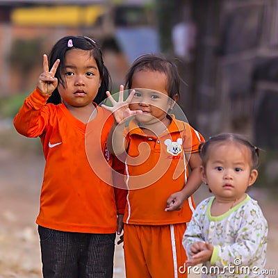 Cambodian girls in Muslim district of the town show their finger Editorial Stock Photo