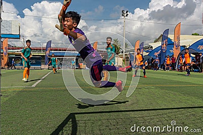 Cambodian goalkeeper in action trying save the ball Editorial Stock Photo