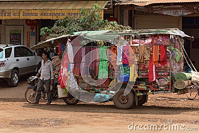 Cambodian man standing close to his car Editorial Stock Photo
