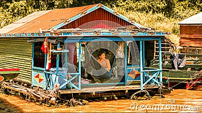 Cambodian people live on Tonle Sap Lake in Siem Reap, Cambodia. Unidentified people in a Floating village on the Tonle Sap Lake Editorial Stock Photo