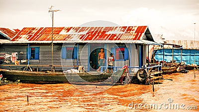 Cambodian people live on Tonle Sap Lake in Siem Reap, Cambodia. Unidentified people in a Floating village on the Tonle Sap Lake Editorial Stock Photo