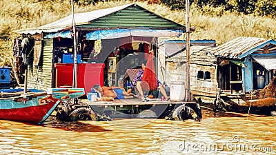 Cambodian people live on Tonle Sap Lake in Siem Reap, Cambodia. Unidentified people in a Floating village on the Tonle Sap Lake Editorial Stock Photo