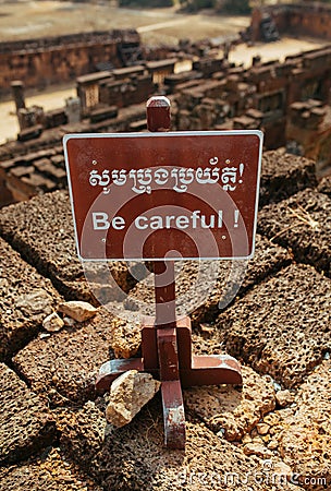 Be Careful Warning sign in Angkor Wat Temple Stock Photo