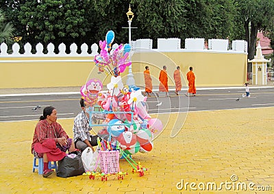 Cambodian woman sells ballins on the street Editorial Stock Photo