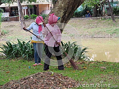 Cambodian women cleaning the street Editorial Stock Photo