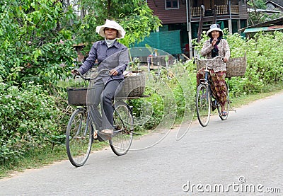 Cambodian women ride bycicle Editorial Stock Photo