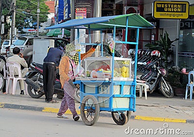 Cambodian women sells food on the street Editorial Stock Photo