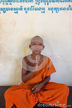 Cambodian young Buddhist monk sitting and meditating, Phnom Penh Editorial Stock Photo