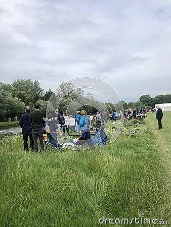 Cambridge, United Kingdom - June 15, 2019: People waiting to watch the Cambridge bumps annual row competition Editorial Stock Photo