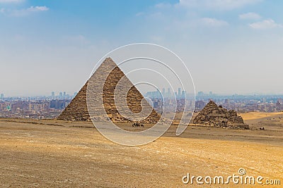 Camel caravan in front of the Great Pyramid of Menkaure Stock Photo