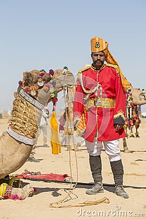 Camel and indian men wearing traditional Rajasthani dress participate in Mr. Desert contest as part of Desert Festival in Jaisalme Editorial Stock Photo