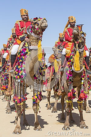 Camel and indian men wearing traditional Rajasthani dress participate in Mr. Desert contest as part of Desert Festival in Jaisalme Editorial Stock Photo