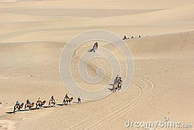 Camel train in desert Stock Photo