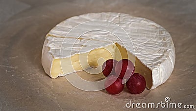 Camembert cream cheese close-up rotating. Head of goat milk cheese with white mold Stock Photo